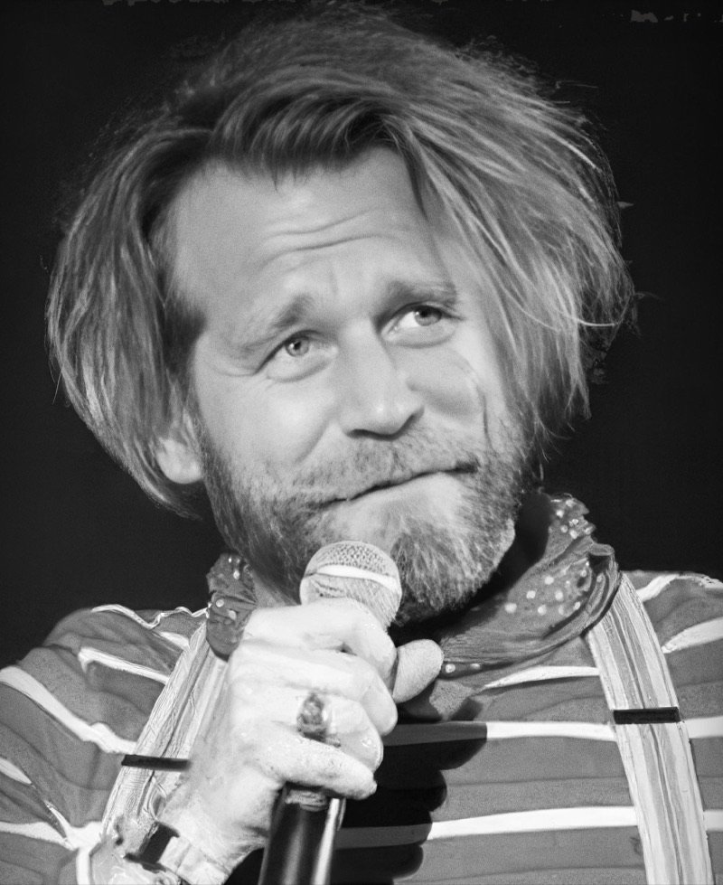 Tony Law holding a microphone
